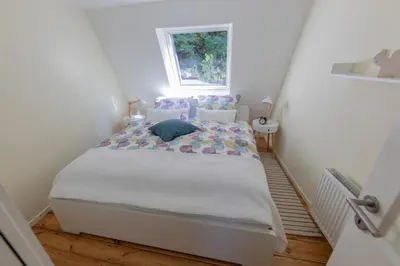 Ein Bett oder Betten in einem Zimmer der Unterkunft Ferienhaus Palatini