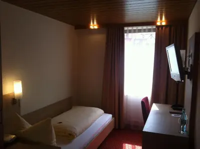 Ein Bett oder Betten in einem Zimmer der Unterkunft Tauberhotel Kette