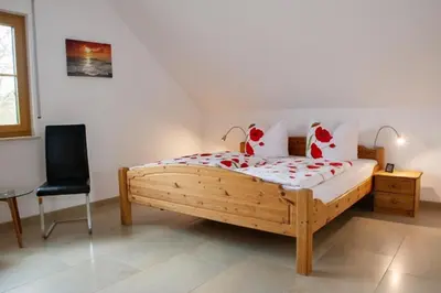 Ein Bett oder Betten in einem Zimmer der Unterkunft Ferienwohnungen Thoma
