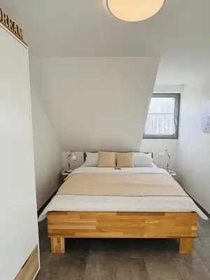Ein Bett oder Betten in einem Zimmer der Unterkunft Ferienwohnung Scheib Aspach
