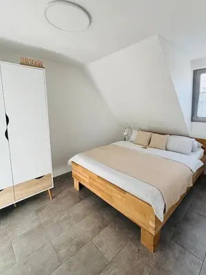 Ein Bett oder Betten in einem Zimmer der Unterkunft Ferienwohnung Scheib Aspach