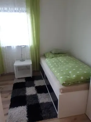 Ein Bett oder Betten in einem Zimmer der Unterkunft Modernes Businessapartement