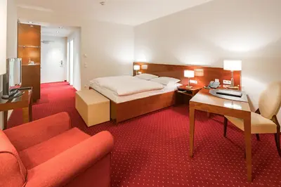 Ein Bett oder Betten in einem Zimmer der Unterkunft Hotel Rose