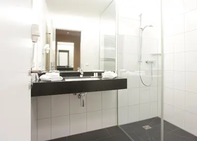 Ein Badezimmer in der Unterkunft Hotel Rose