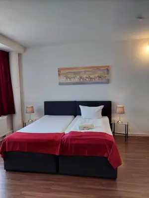 Ein Bett oder Betten in einem Zimmer der Unterkunft Apart-Hotel-Kick