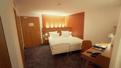 Ein Bett oder Betten in einem Zimmer der Unterkunft Hotel Adler Asperg