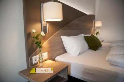 Ein Bett oder Betten in einem Zimmer der Unterkunft Wein & Bett Weihbrecht