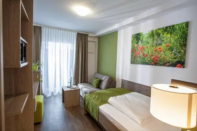Ein Bett oder Betten in einem Zimmer der Unterkunft Wein & Bett Weihbrecht