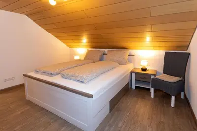 Ein Bett oder Betten in einem Zimmer der Unterkunft Gästezimmer - Ferienwohnung 2 - Brauhaus Dürr