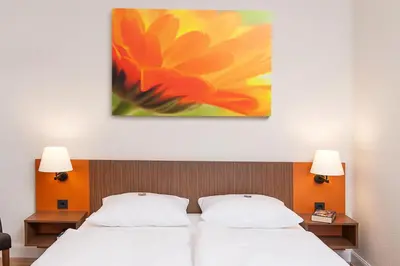 Ein Bett oder Betten in einem Zimmer der Unterkunft Bildungshaus St. Bernhard - Wohnen und Tagen