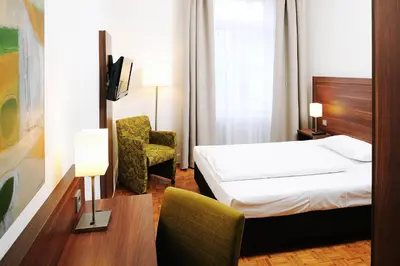 Ein Bett oder Betten in einem Zimmer der Unterkunft Bildungshaus St. Bernhard - Wohnen und Tagen