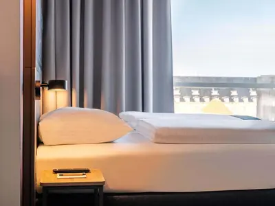 Ein Bett oder Betten in einem Zimmer der Unterkunft B&B Hotel Mainz-Hechtsheim