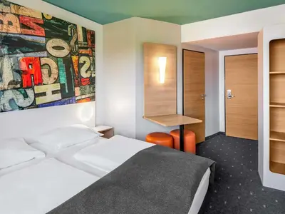 Ein Bett oder Betten in einem Zimmer der Unterkunft B&B Hotel Mainz-Hechtsheim
