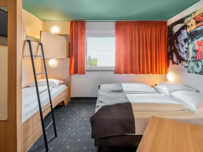 Ein Bett oder Betten in einem Zimmer der Unterkunft B&B Hotel Mainz-Hechtsheim