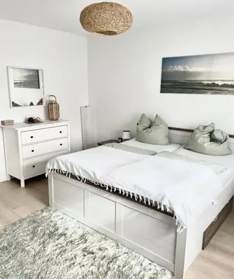 Ein Bett oder Betten in einem Zimmer der Unterkunft Ferienwohnung Lauer
