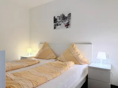 Ein Bett oder Betten in einem Zimmer der Unterkunft Kastanienhof Apartment Hotel
