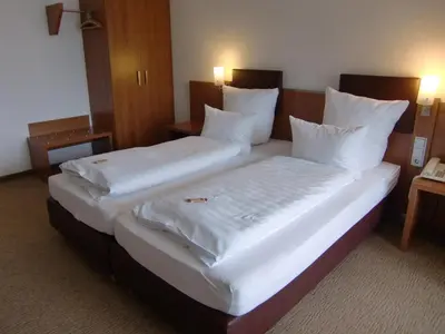 Ein Bett oder Betten in einem Zimmer der Unterkunft Hotel Darstein