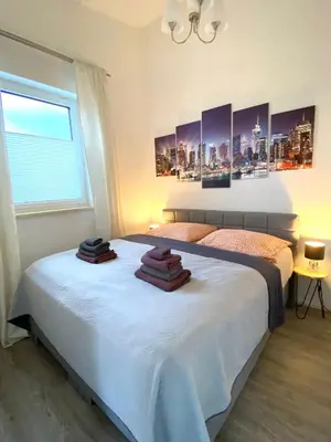 Ein Bett oder Betten in einem Zimmer der Unterkunft Larimar Apartment Kirchheim am Neckar