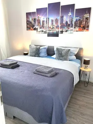 Ein Bett oder Betten in einem Zimmer der Unterkunft Larimar Apartment Kirchheim am Neckar