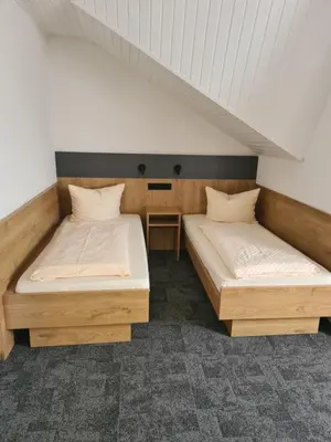 Ein Bett oder Betten in einem Zimmer der Unterkunft Gästehaus Weber