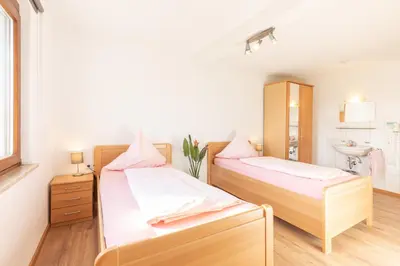 Ein Bett oder Betten in einem Zimmer der Unterkunft Schäfer's Ferienhof Michaelsberg