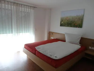 Ein Bett oder Betten in einem Zimmer der Unterkunft Ferienwohnung 4 in den Krautgärten