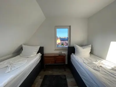 Ein Bett oder Betten in einem Zimmer der Unterkunft Grüner Baum