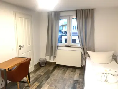 Ein Bett oder Betten in einem Zimmer der Unterkunft Grüner Baum
