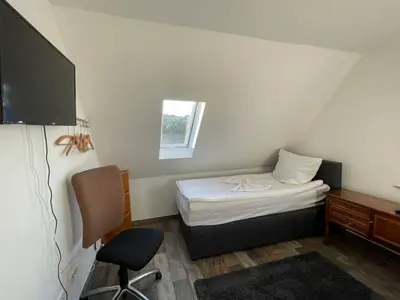 Ein Bett oder Betten in einem Zimmer der Unterkunft Grüner Baum