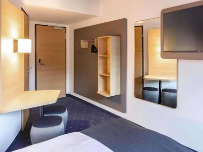 Ein Bett oder Betten in einem Zimmer der Unterkunft B&B Hotel Kaiserslautern
