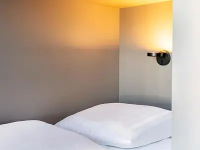 Ein Bett oder Betten in einem Zimmer der Unterkunft B&B Hotel Kaiserslautern