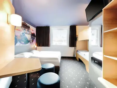 Ein Bett oder Betten in einem Zimmer der Unterkunft B&B Hotel Kaiserslautern