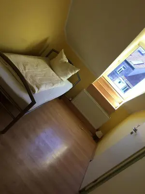 Ein Bett oder Betten in einem Zimmer der Unterkunft Doppelbettzimmer mit Bad