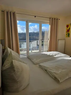 Ein Bett oder Betten in einem Zimmer der Unterkunft Hotel Sonne Garni