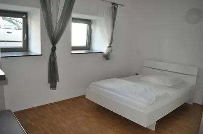 Ein Bett oder Betten in einem Zimmer der Unterkunft New Age Boardinghaus