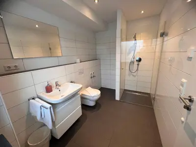 Ein Badezimmer in der Unterkunft New Age Boardinghaus