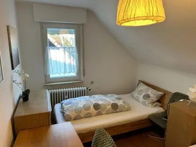Ein Bett oder Betten in einem Zimmer der Unterkunft Central Apartment Rödermark 3Zimmer
