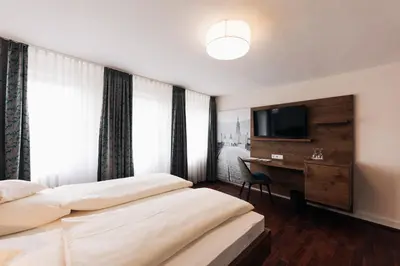 Ein Bett oder Betten in einem Zimmer der Unterkunft Hotel Weisser Bock
