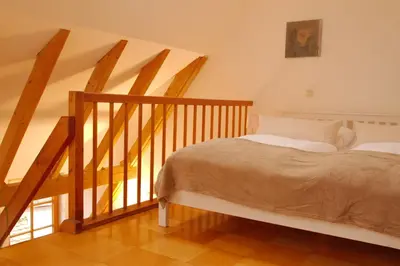 Ein Bett oder Betten in einem Zimmer der Unterkunft Ferienwohnung Bildgasse