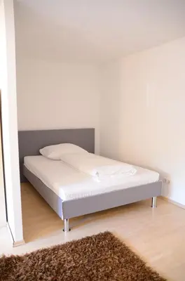 Ein Bett oder Betten in einem Zimmer der Unterkunft LMS Apartments