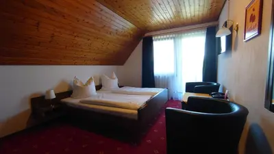Ein Bett oder Betten in einem Zimmer der Unterkunft Hotel Landgasthof Fromm