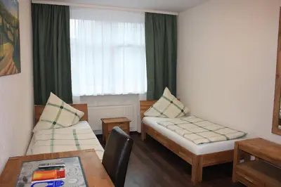 Ein Bett oder Betten in einem Zimmer der Unterkunft Isenburger Hof