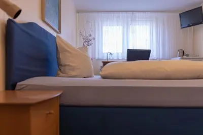 Ein Bett oder Betten in einem Zimmer der Unterkunft Alfa Apartment Hotel