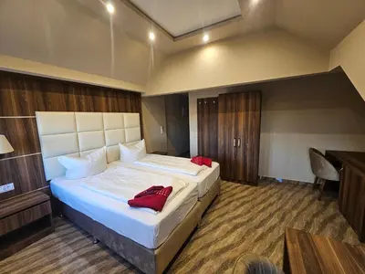 Ein Bett oder Betten in einem Zimmer der Unterkunft Hotel City Faber