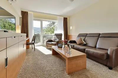 Ein Sitzbereich in der Unterkunft Arens Hotel 327mNN