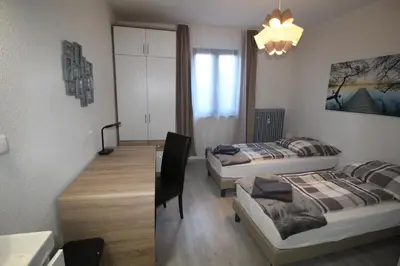 Ein Bett oder Betten in einem Zimmer der Unterkunft Aussicht Mainz-City - 4 Zimmer-max 7 Personen