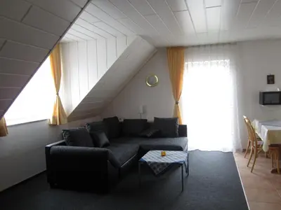 Ein Sitzbereich in der Unterkunft Hotel Waldparkstube
