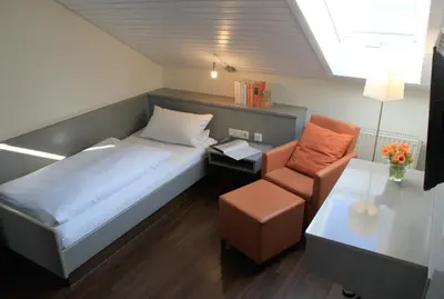 Ein Bett oder Betten in einem Zimmer der Unterkunft Hotel An der Linde