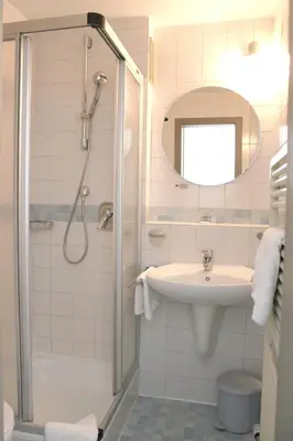 Ein Badezimmer in der Unterkunft Hotel An der Linde