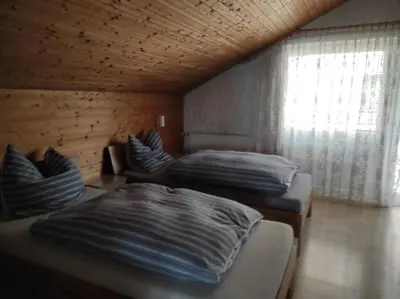 Ein Bett oder Betten in einem Zimmer der Unterkunft Ferienwohnung Gartenblick